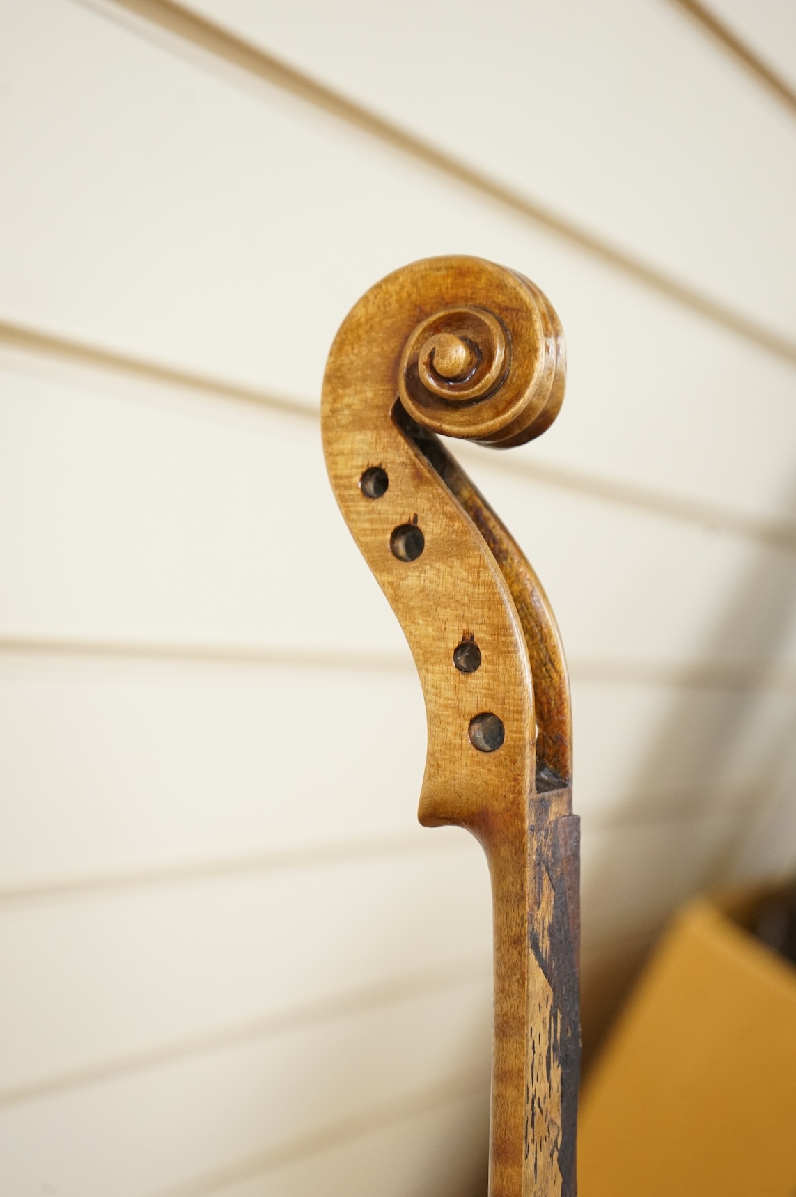 Three cased violins; a German Dresden violin, supplied by Campbell and co., Glasgow, together with another Dresden Stradivarius copy, and the remains of a European violin.